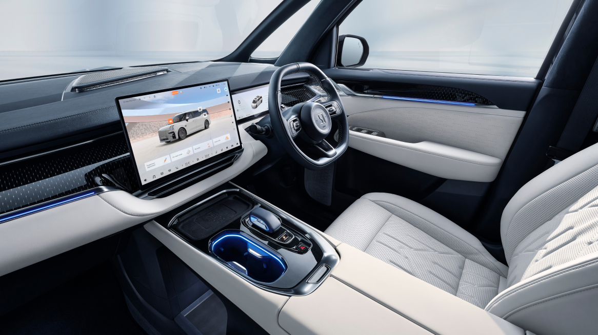 Front cabin view of the Zeekr 009 luxury electric MPV featuring a 15.05-inch OLED touchscreen, premium steering wheel, ambient lighting, and quilted Nappa leather seats for enhanced comfort and advanced functionality.